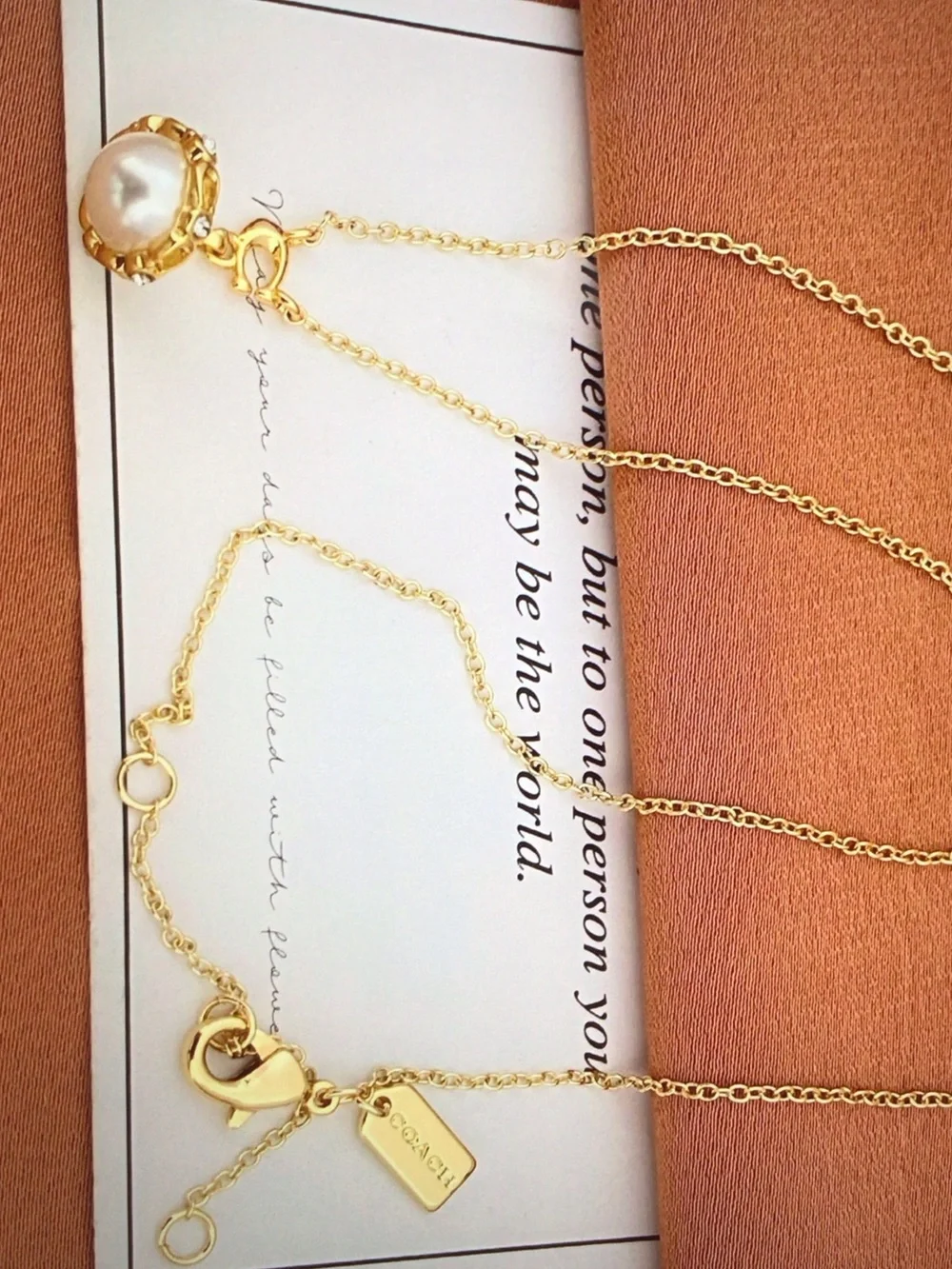 Coach gold tone